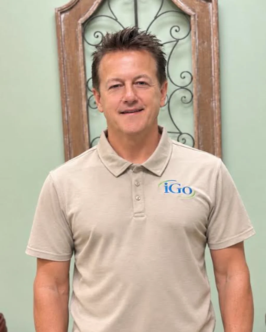 Steve, President of iGo Technology, smiling in an iGo polo shirt